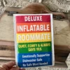 Close-up of a Deluxe Inflatable Roommate novelty sticker featuring a rainbow design and humorous roommate benefits.