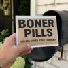 Boner Pills Prank Mail Delivery Person holding a Boner Pills prank mailer beside an open residential mailbox