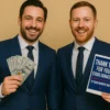 Two men in suits smiling while holding the Conservative Party Donation prank label — funny political-themed gag gift from TheOneAndOnly.ca