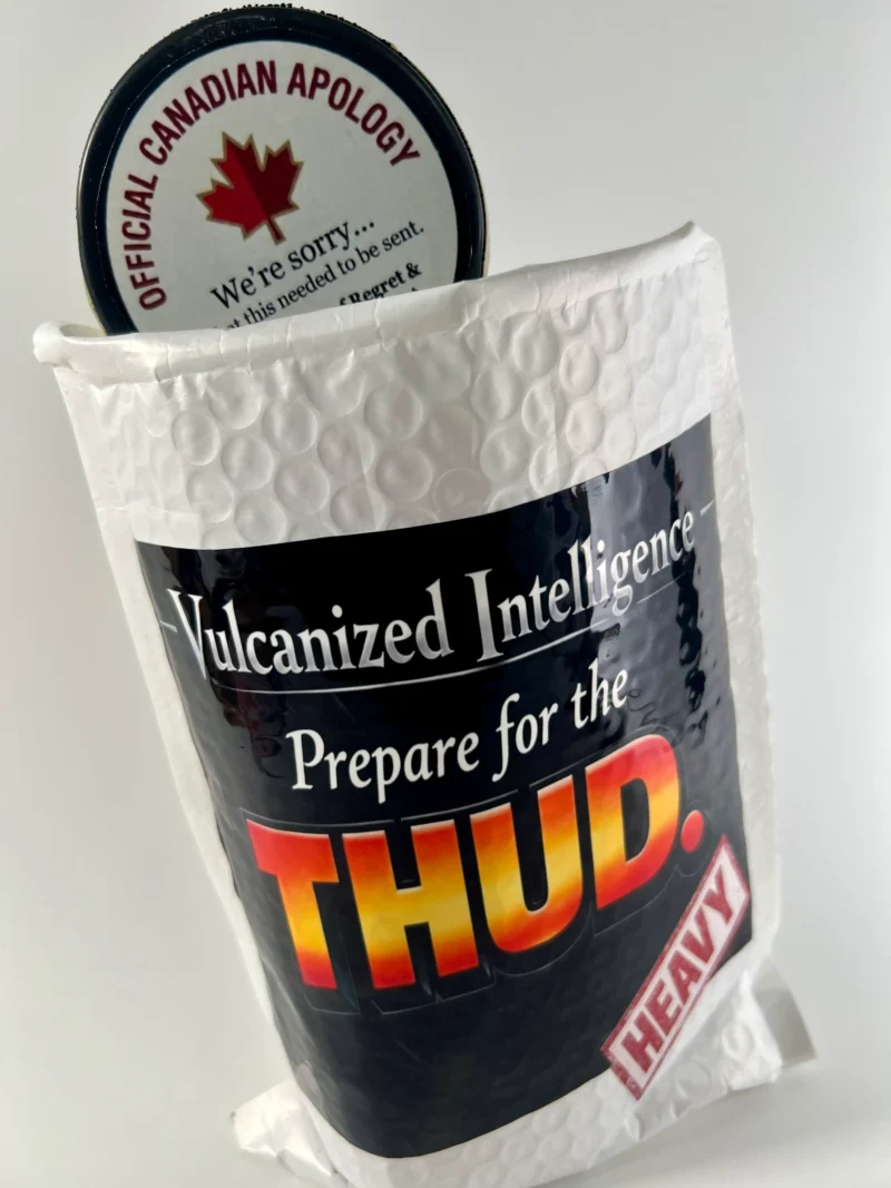 The Puck Drop prank mail hockey puck inside bubble mailer labeled Prepare for the THUD