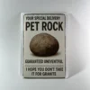 Pet Rock prank mail gag gift label featuring a rock novelty package with the joke "Guaranteed Uneventful. I hope you don’t take it for granite"