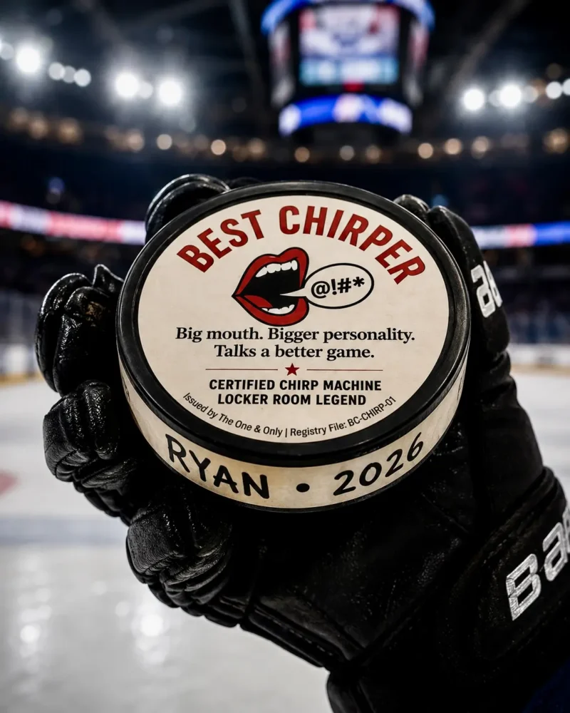 Best Chirper hockey puck award with custom name and year message held by a hockey player on the ice.