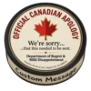 Official Canadian Apology hockey puck with custom message edge and Canadian maple leaf design
