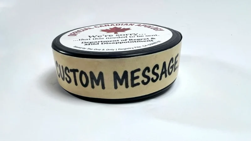 Custom hockey puck with personalized side message and custom award design.
