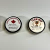 Collection of custom hockey pucks featuring personalized messages, awards, and funny hockey gift designs.