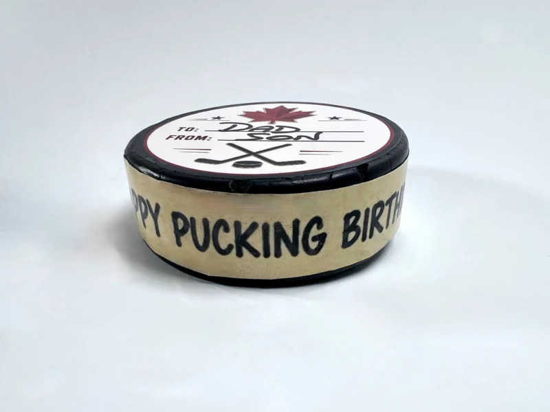 Happy Pucking Birthday custom hockey puck with personalized birthday message.