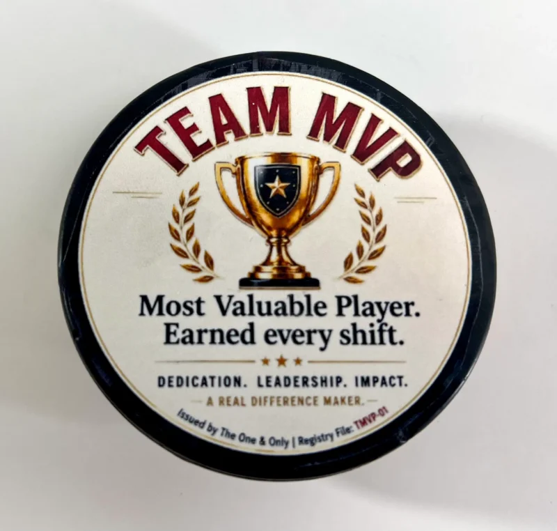 Team MVP custom hockey puck award with Most Valuable Player design and personalized side message.