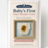 Baby’s First Diaper Keepsake Frame novelty package featuring a stained diaper inside an odour sealed wooden display frame.