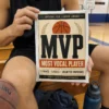 Most Vocal Player Basketball Prank Mail Basketball player holding a Most Vocal Player prank mailer on gym bleachers
