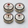 The Puck Drop™ Custom Hockey Puck Options Four custom hockey pucks showing personalized top designs and edge messages