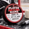 Player of the Game hockey puck award with player name date and opponent written in Sharpie