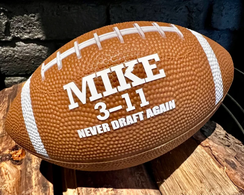 Personalized Fumble fantasy football displayed on wood with Mike 3-11 and Never Draft Again