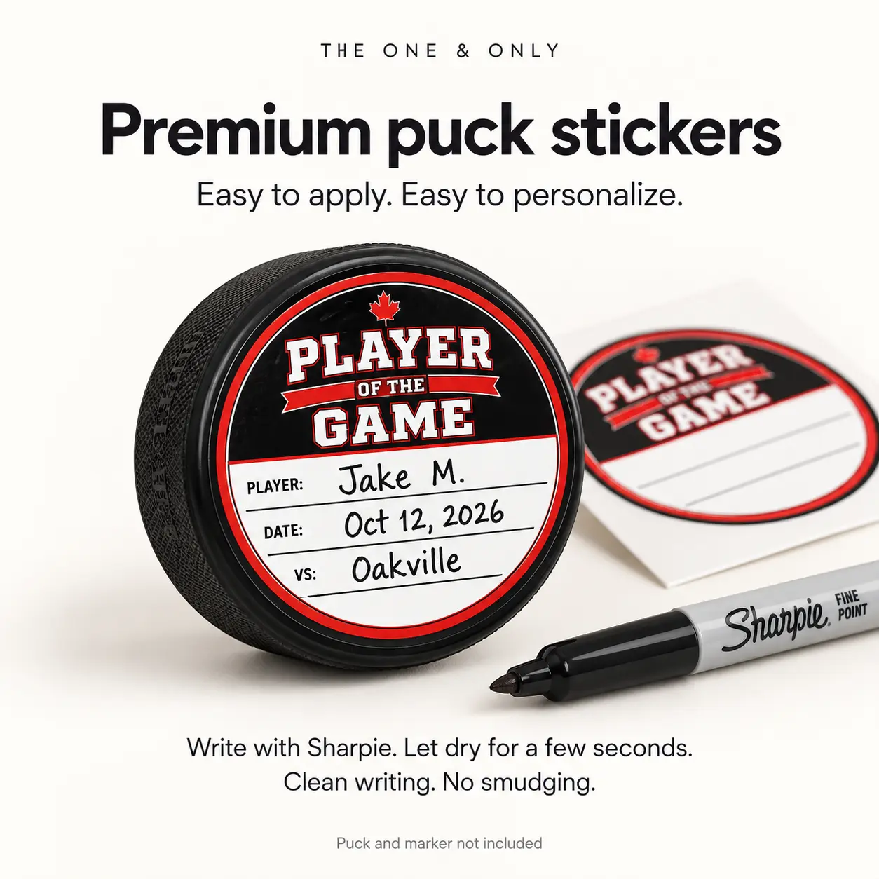 Player of the Game puck sticker with handwritten player, date and opponent details beside a permanent marker