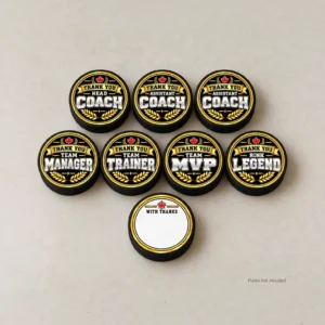 Gold and black hockey thank you stickers shown on seven pucks, with a blank “With Thanks” back below. Product mockup; pucks not included.