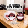 20 Player of the Game hockey puck stickers fanned beside a black puck displaying the red, black and white award design on a wooden locker room bench. Pucks not included.